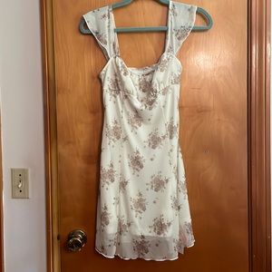 NWT beige floral sun dress. Cream lining and wide ruffle straps